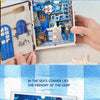A DIY book nook kit featuring a detailed sea scene with blue and white elements, displayed in an open box.
