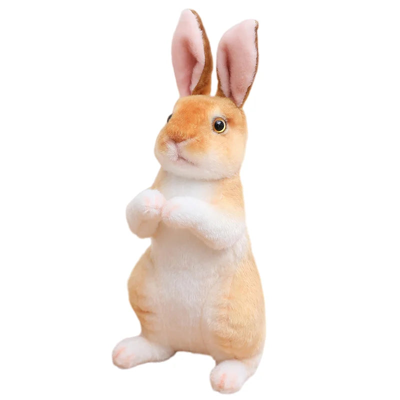 A fluffy, light orange plush rabbit stuffed animal with pink ears.