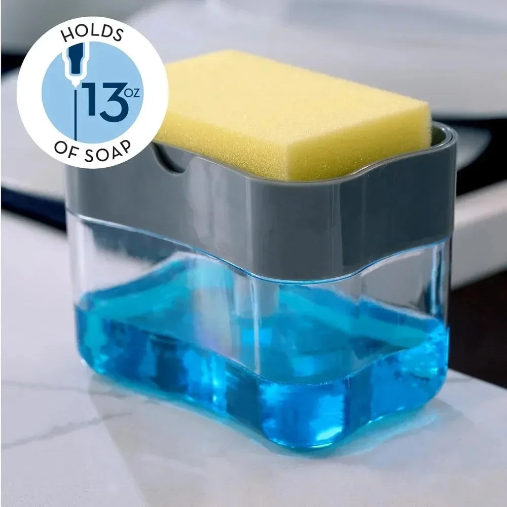 A clear soap dispenser holds a yellow sponge and a blue liquid soap.
