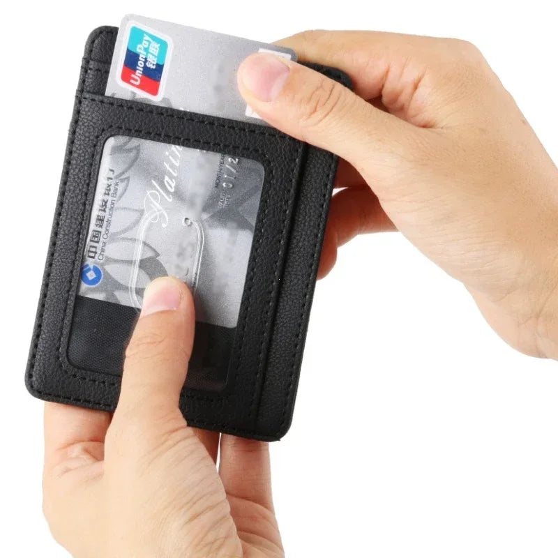 A hand holds a black slim leather wallet with an UnionPay ID card inside.