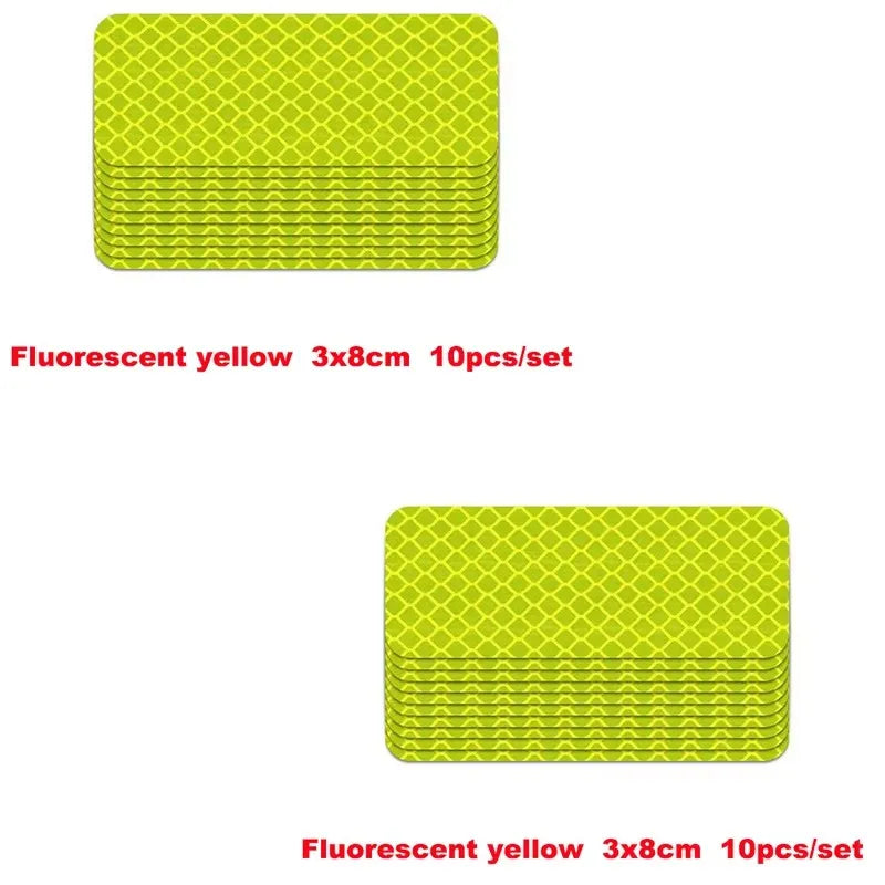 A set of ten fluorescent yellow 3x8cm reflective strip stickers for car safety.