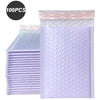 A stack of 100 purple bubble mailers with a self-seal feature shown next to the packaged product.