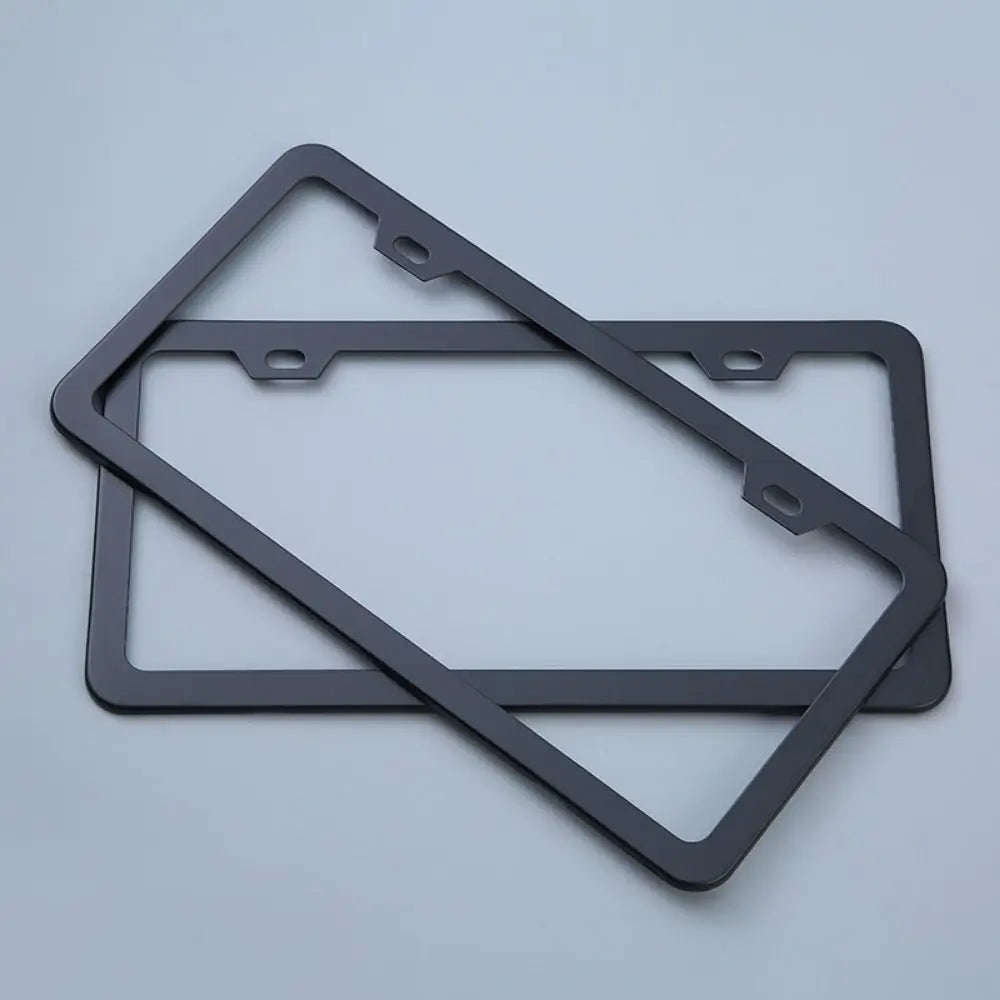 A black rustproof stainless steel license plate frame with a rectangular cutout and mounting tabs.