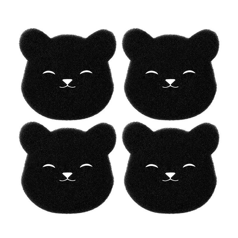 Un set de quatre éponges réutilisables pour enlever les poils d'animaux, en forme de chats.