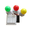 A kit of three colored spinning balls (green, red, yellow) mounted on a white base with switches.