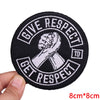 Black embroidered iron-on letter patch with white text that reads Give Respect to Get Respect