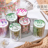 A display of various colored Mountain Vines decorative PET tape rolls for journaling and crafts.