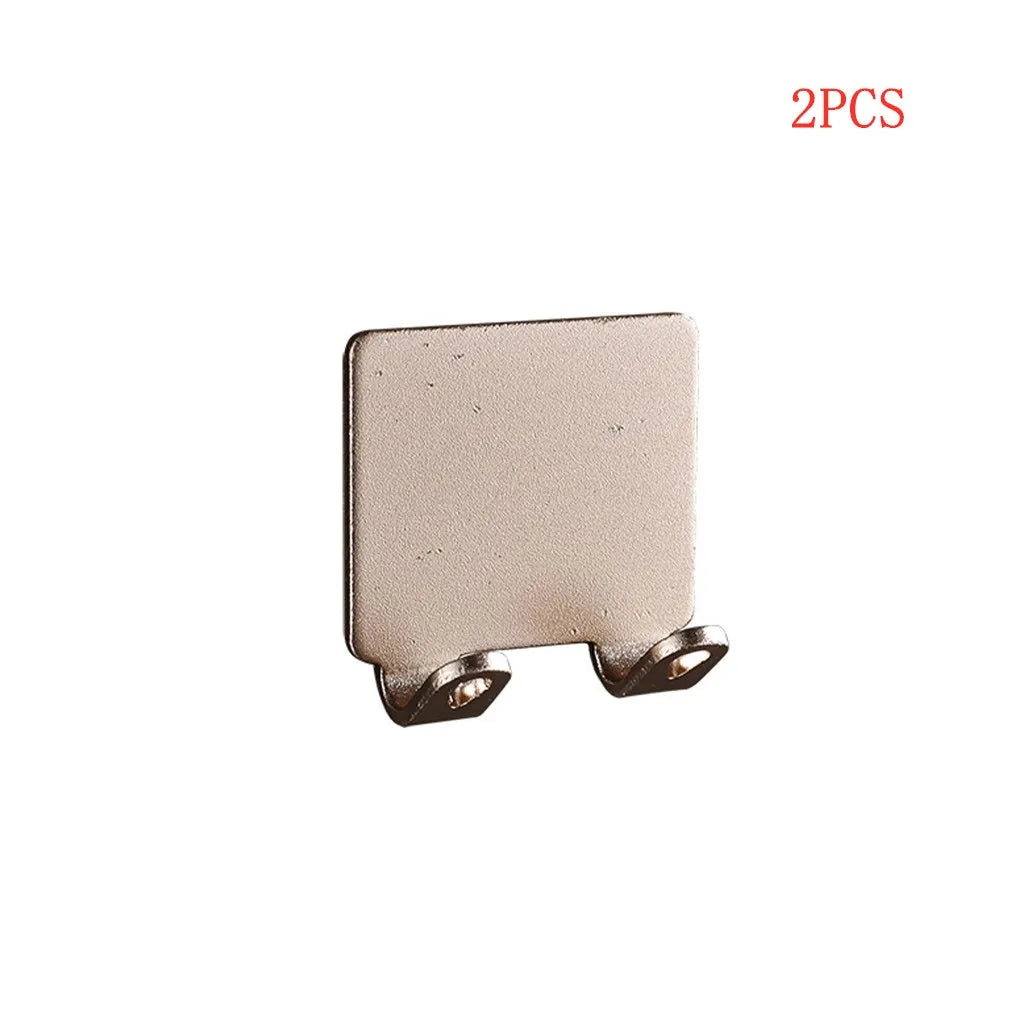 Two aluminum wall-mounted adhesive razor holders.