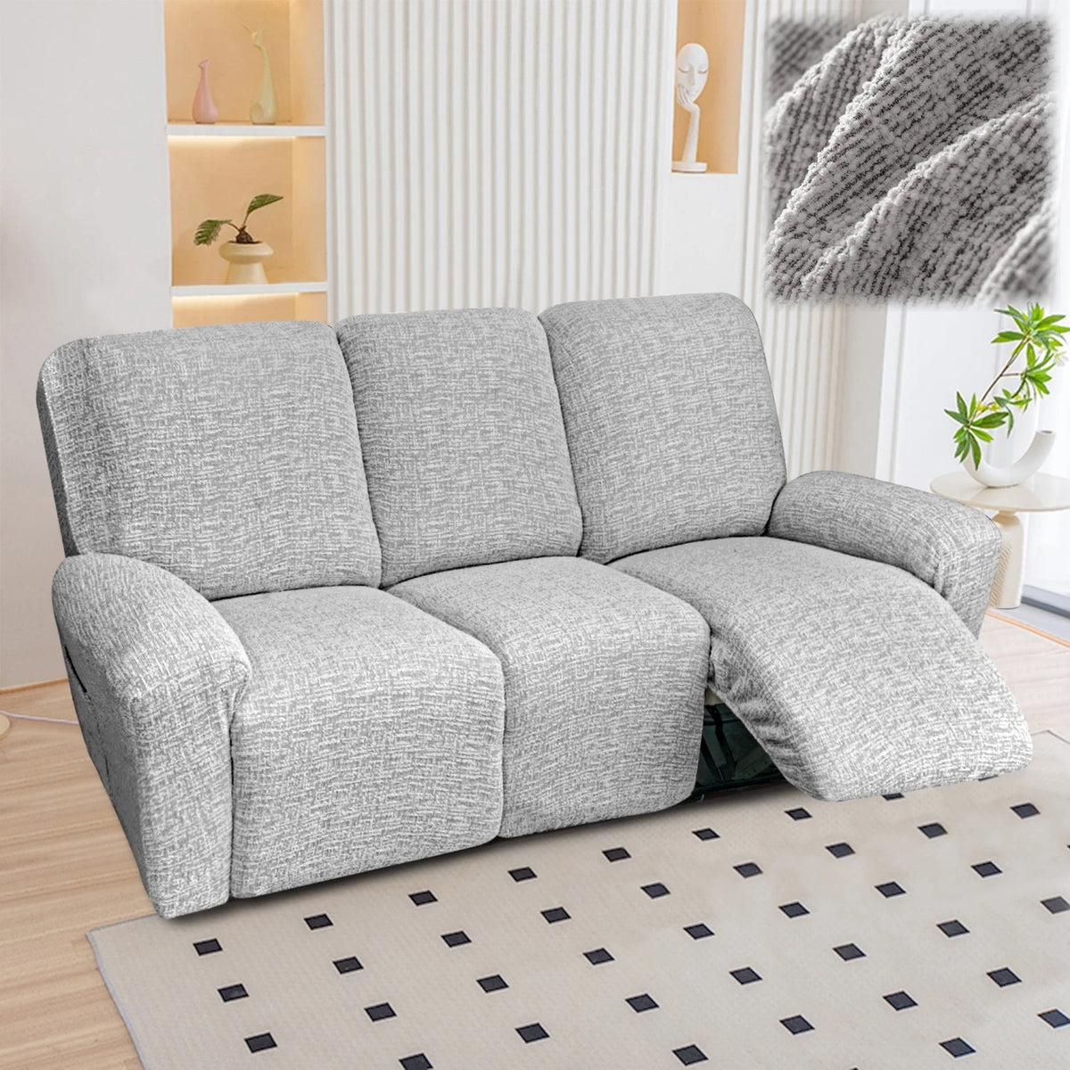 A gray heavy-duty linen stretch sofa cover for recliners is displayed on a light rug.
