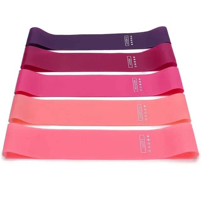A set of five colored portable resistance bands for fitness and yoga