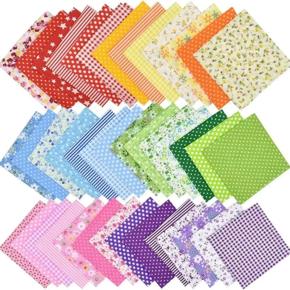 A bundle of colorful cotton fabric squares featuring various floral and geometric dot patterns for patchwork and quilting