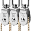 Three stainless steel swivel pulleys with hooks hanging from thick rope