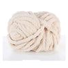 A ball of light beige chunky acrylic yarn used for knitting and crochet