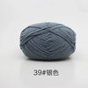 A ball of gray 4-ply milk cotton yarn for knitting and crochet.