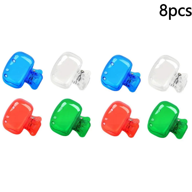 Eight protective toothbrush head covers in blue, white, and red colors with travel clips.