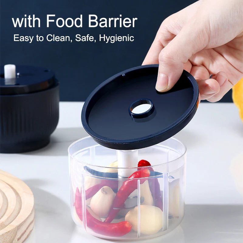 A hand is placing a black food barrier lid onto a clear container filled with chili peppers and garlic for a mini electric fo