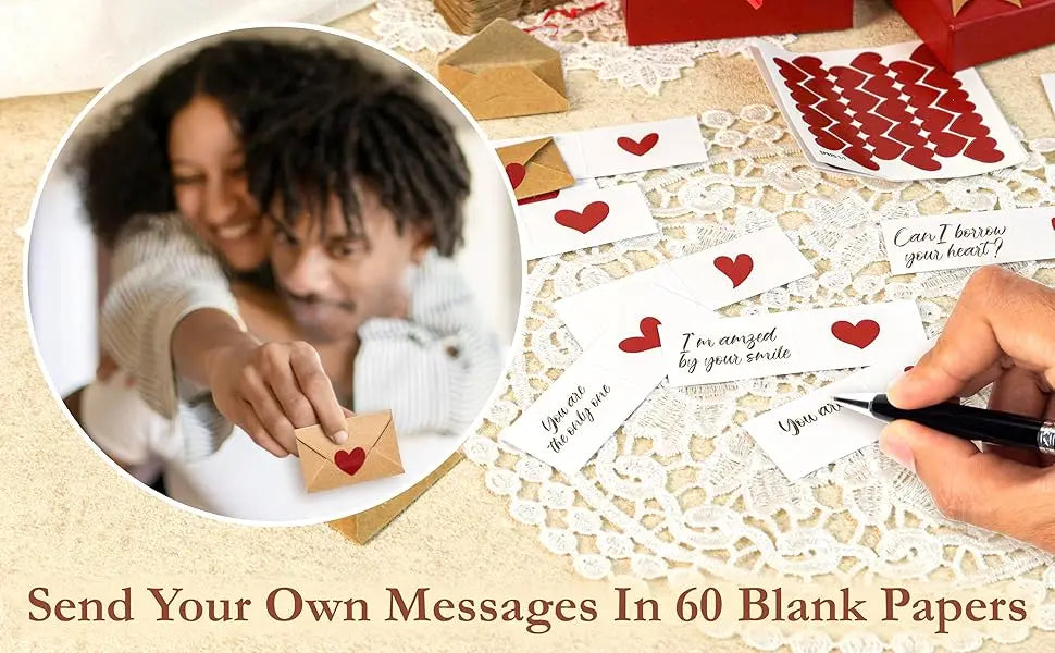 A hand writes a message on a blank note card and envelope set for sending love notes.