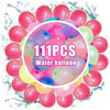 A pile of 111 pink and purple water balloons scattered on a white surface.