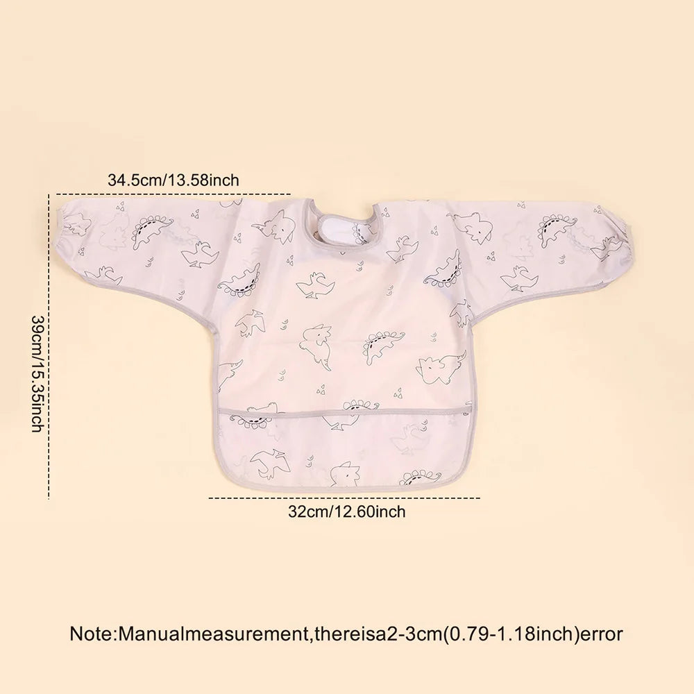 A light pink waterproof long-sleeve baby feeding smock with a decorative pattern.