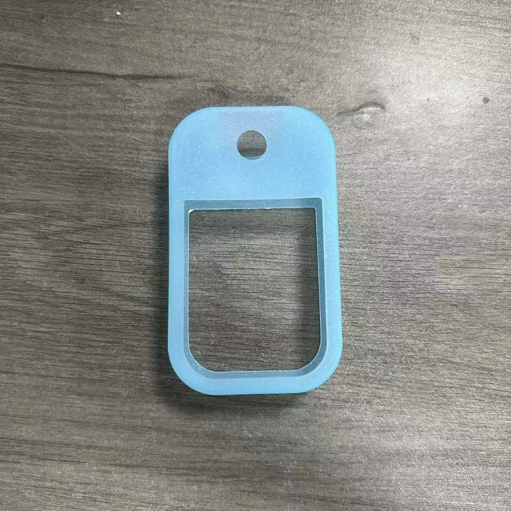 Light blue silicone protective case for a hand sanitizer spray with a keyring.