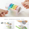 A clear storage box holds various colored rolls of washi tape, demonstrating its easy design and storage.