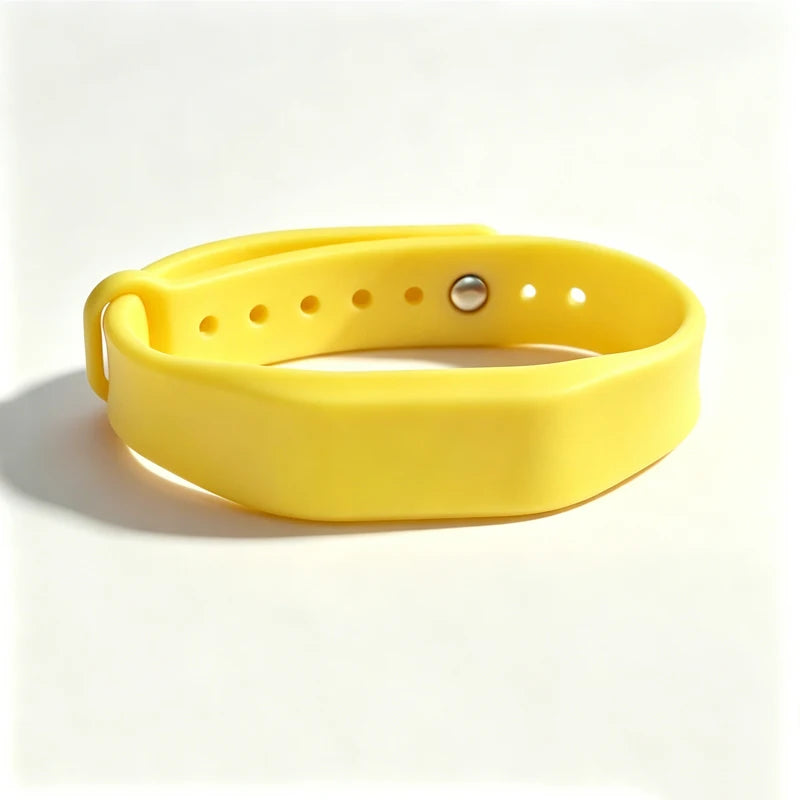 A bright yellow silicone wristband with a silver clasp, designed for access control.