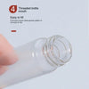 A hand is holding a clear glass bottle with a threaded mouth, demonstrating its easy-to-fill design.