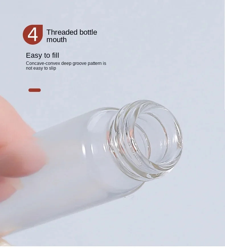 A hand is holding a clear glass bottle with a threaded mouth, demonstrating its easy-to-fill design.