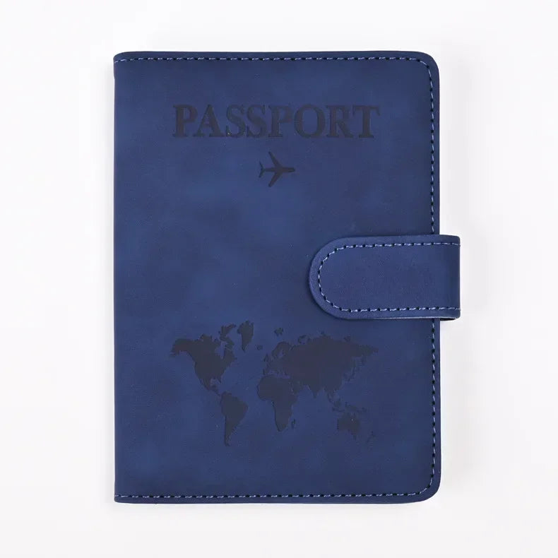 A dark blue leather passport holder with the word PASSPORT and a world map design.