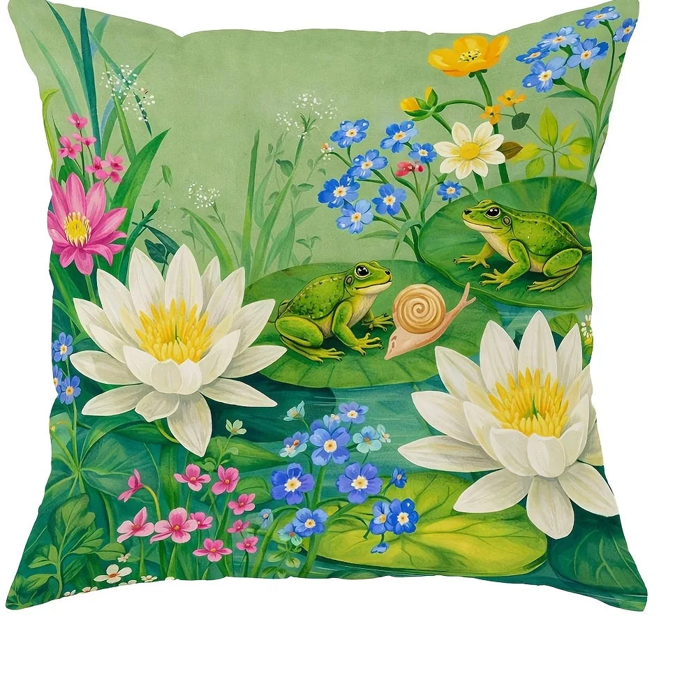 A floral print throw pillow cover featuring green leaves, yellow and blue wildflowers, and a small green frog.