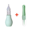 A light green baby nasal aspirator device with a silicone tip and a separate green suction piece.