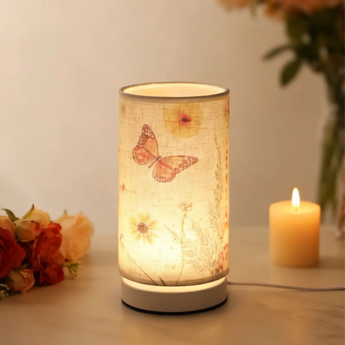 A Nordic retro USB table lamp with a fabric shade glowing warmly on a white surface.