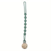 A silicone pacifier clip with a teether, featuring a green, elongated chain design.