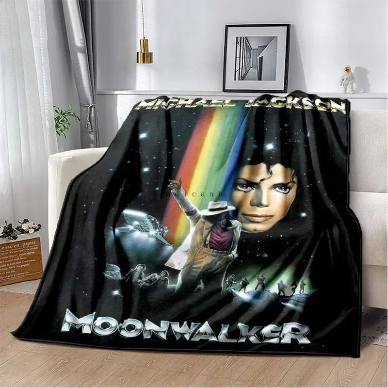 A black flannel throw blanket featuring a graphic print of Michael Jackson and the text MOONWALKER.