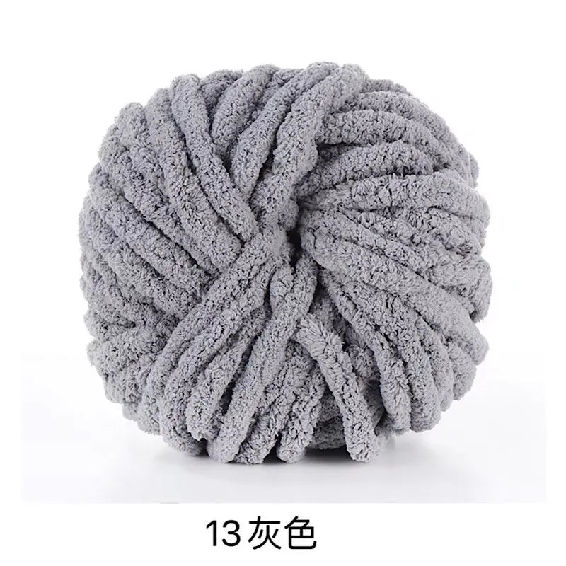 A ball of gray chunky acrylic yarn used for knitting and crochet