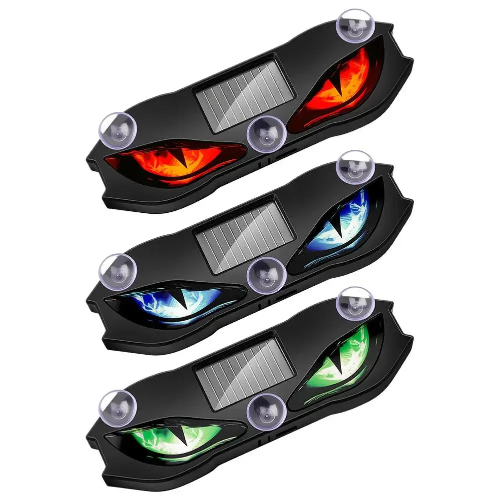 Black solar-powered car ambient light featuring a demon eye design with glowing red and blue lights