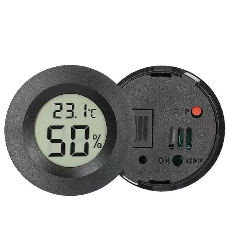 A black mini digital hygrometer thermometer showing a temperature of 23.1°C and 50% humidity.