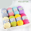 A collection of brightly colored milk cotton yarn skeins in various shades including pink, purple, blue, and yellow.