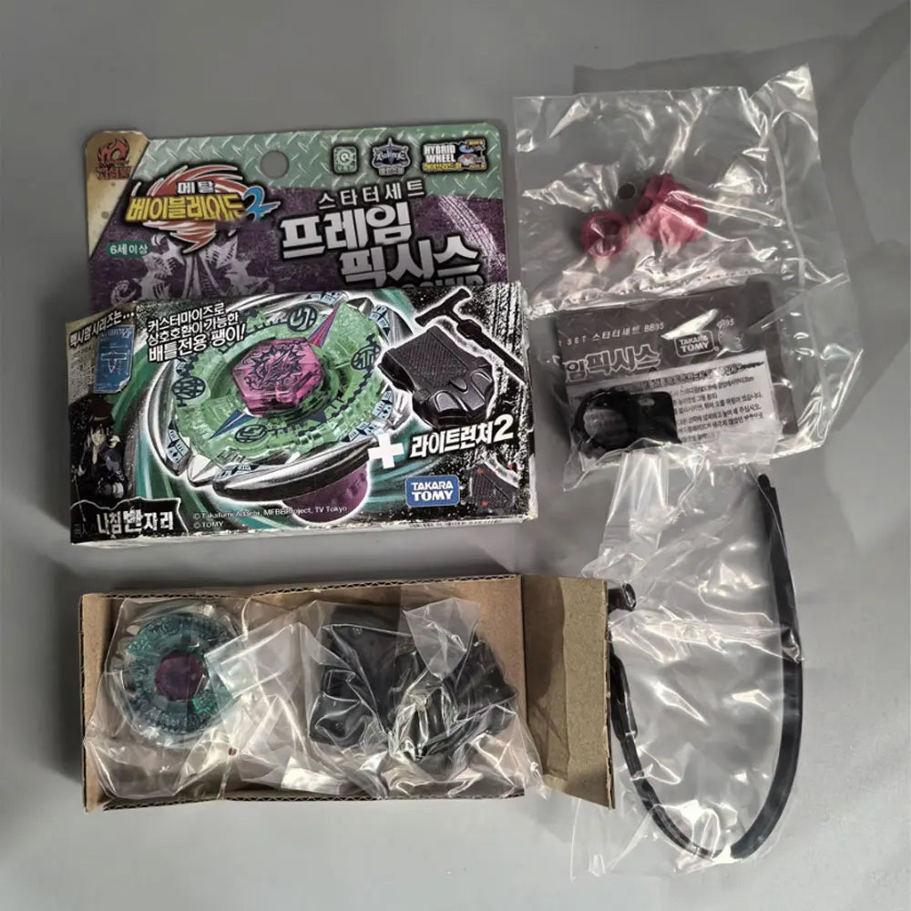 A set of premium metal spinning tops and accessories packaged in plastic and cardboard boxes.