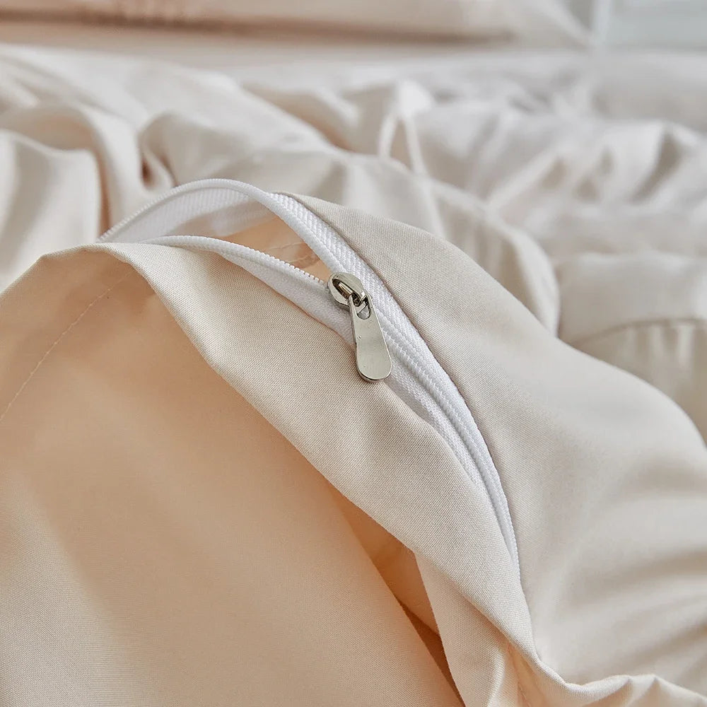 A close-up of a light beige pleated duvet cover with a white zipper detail.