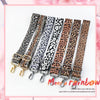 A set of five leopard print wide adjustable crossbody bag straps in various shades of brown and black.