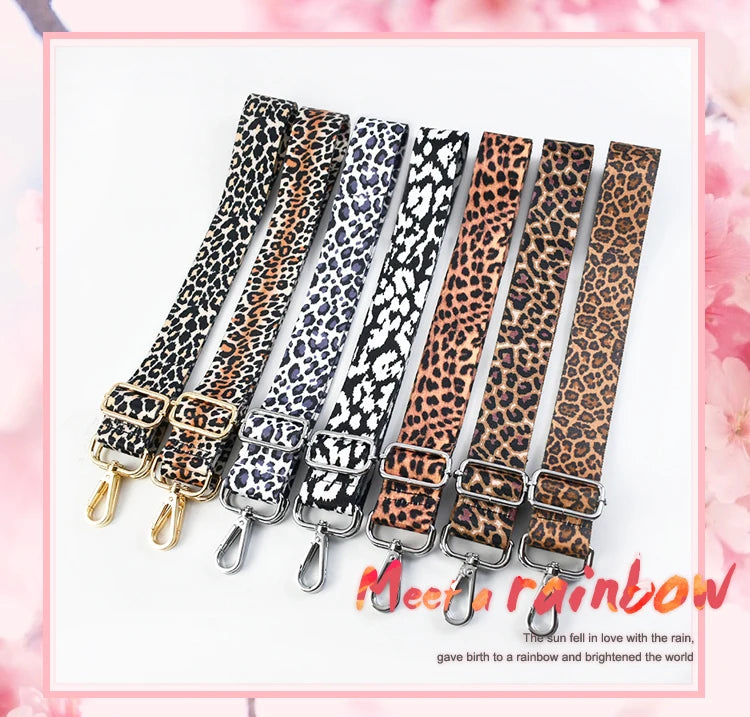A set of five leopard print wide adjustable crossbody bag straps in various shades of brown and black.
