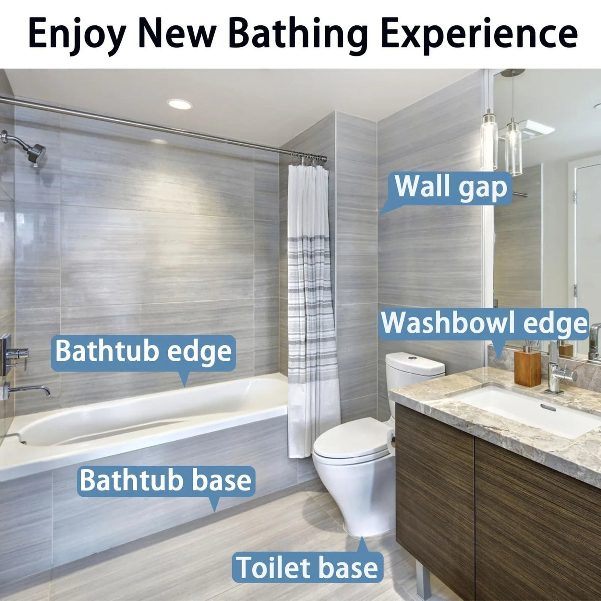 A modern bathroom featuring a bathtub, toilet, and vanity area with light gray tiled walls.