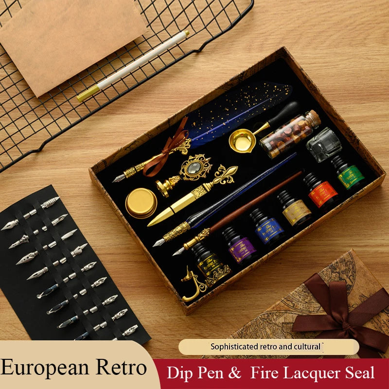 A set of European retro dip pens and fire lacquer seals displayed in an open wooden box on a light wood surface.