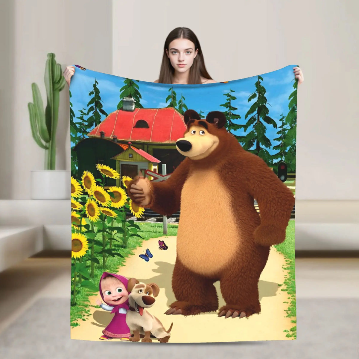 A flannel throw blanket featuring a cartoon design of Masha and Bear in a forest setting.
