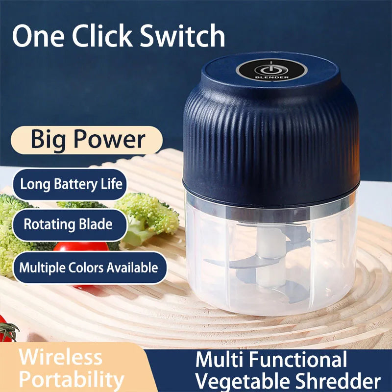 A blue mini electric vegetable shredder with a rotating blade is shown on a wooden cutting board.
