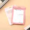 A pink Mylar ziplock bag with a clear window is shown next to a white bag on a light background.