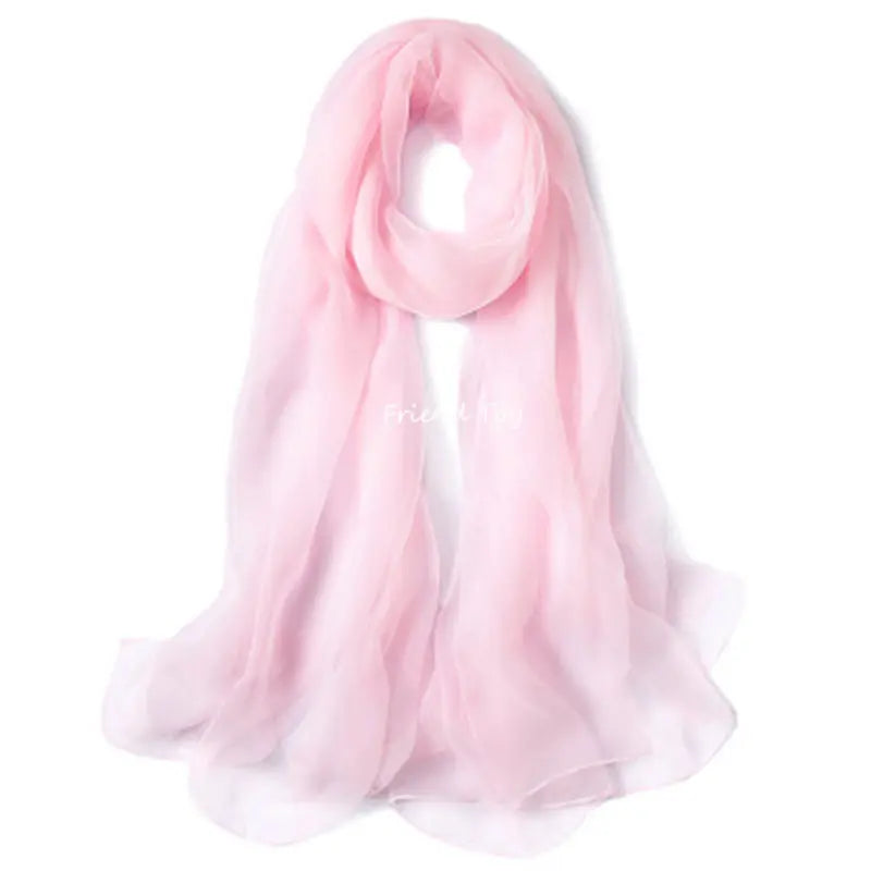 A soft pink silk scarf draped elegantly