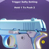 A light blue model pistol with a textured grip is shown, illustrating the trigger safety setting Hold 1 to Push 2.