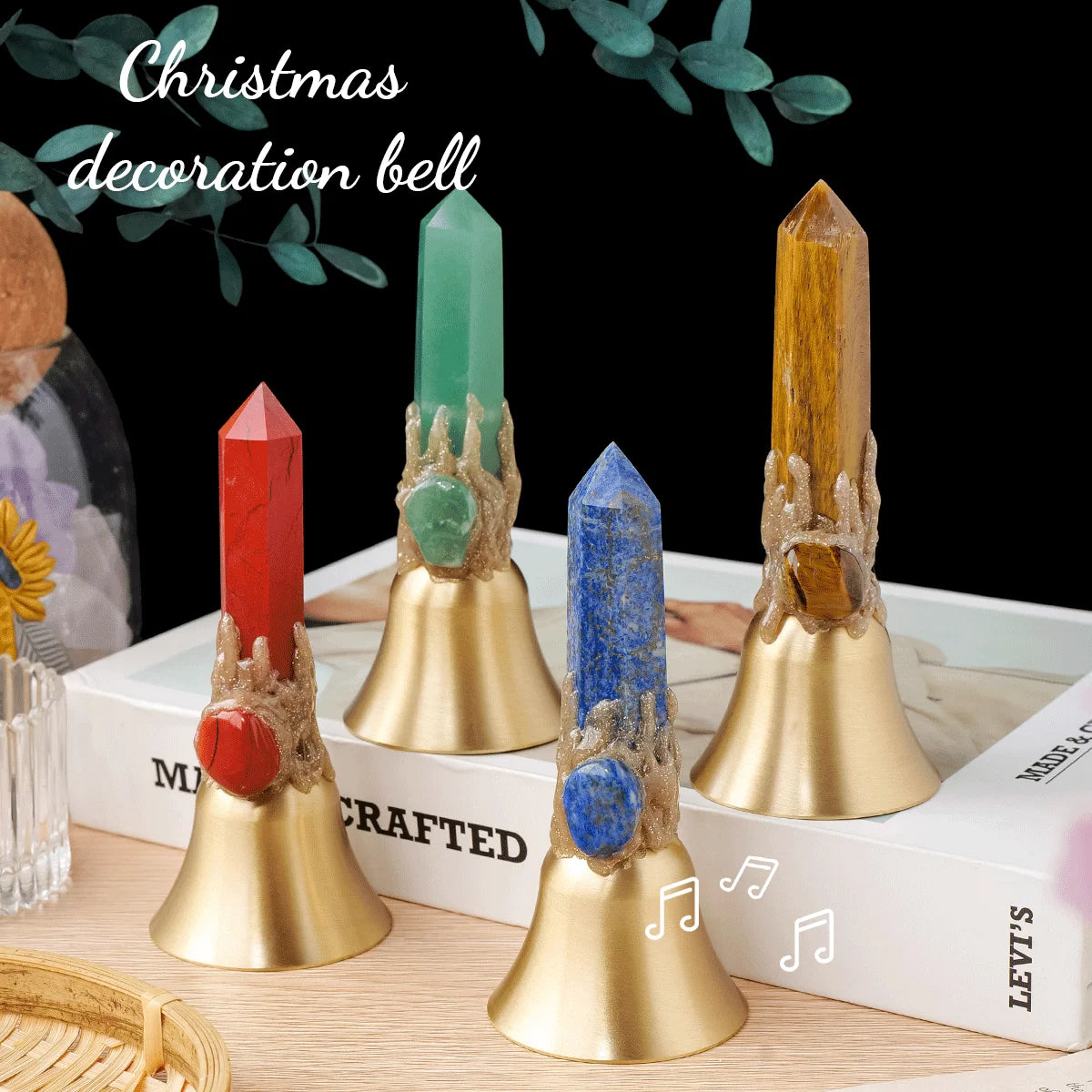 A collection of natural crystal points mounted on brass bells for Christmas decoration.